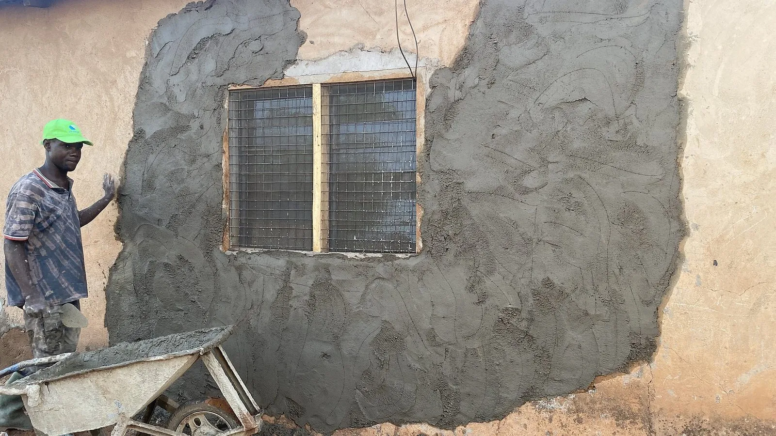 Plaster skim coating applied to a wall with a trowel