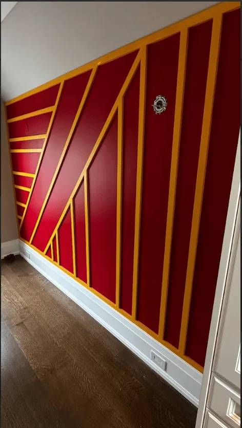 Red and gold geometric accent wall